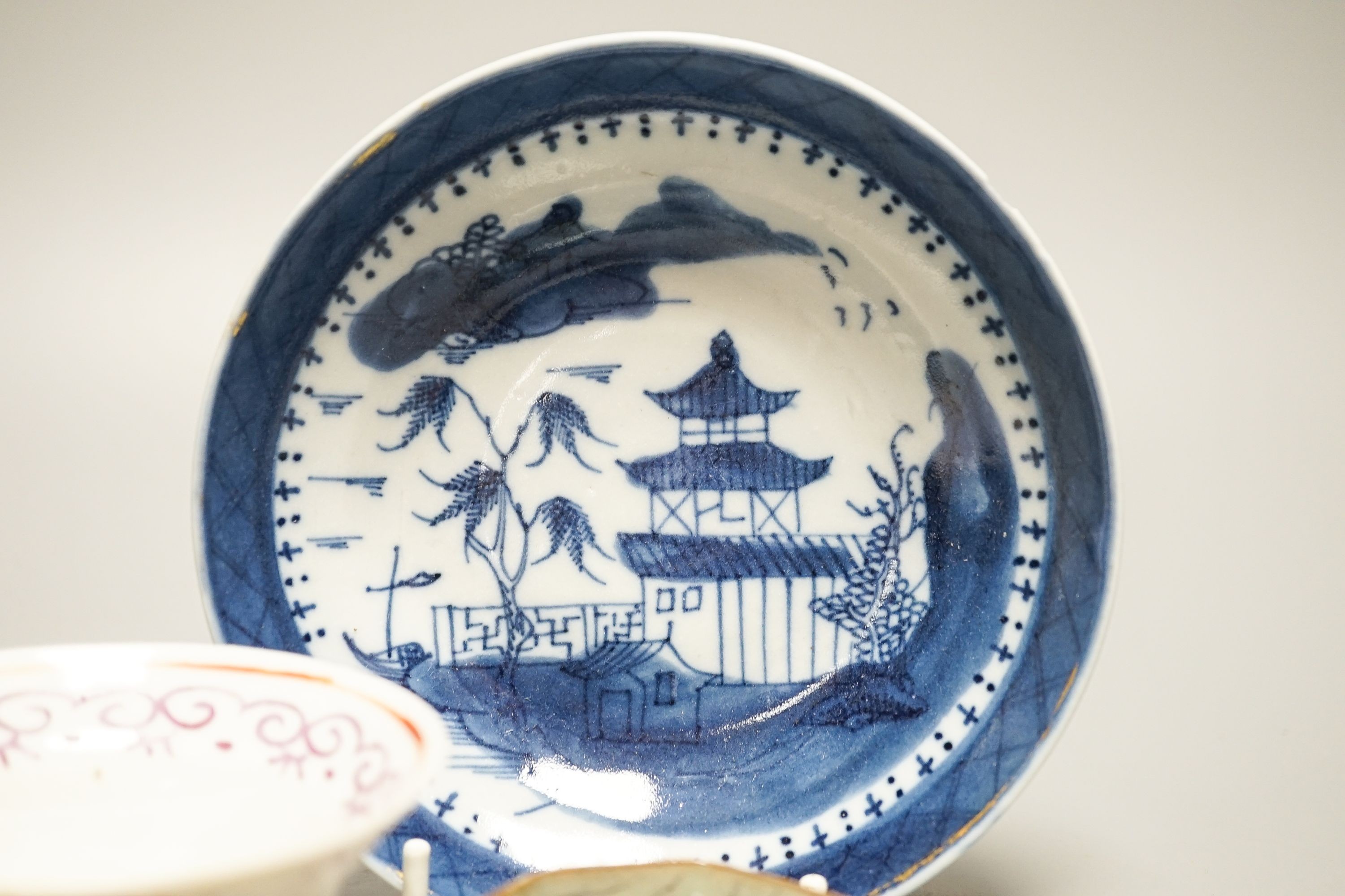 A Chinese Imari tea bowl and saucer, a famille rose tea bowl, a saucer and a celadon glazed cup